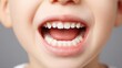 © The Little Hut - Close-up of a child's mouth with healthy, clean teeth showing good oral hygiene and dental care