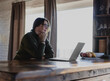 © olezzo - Mature caucasian woman in eyeglasses working on laptop at home office in countryside house.Mature caucasian woman in eyeglasses working on laptop at home office in countryside house.