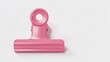 © TANJILAAMAN - features a single, pink metal binder clip centered against a plain white background. The clip has a smooth, glossy finish and a circular hole at the top, which is typical for hanging or attaching purp
