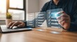 © Arsal Stock - Close-up of a hand interacting with holographic digital checklist interface floating above a wooden desk illustrates.