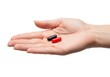 © png stock - A hand holding a small pill and a capsule, showcasing different types of medication. isolated on white background