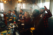 © Zamrznuti tonovi - People watching soccer match in pub cheering goal
