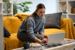 © Zoran Jesic - Woman freelancer working from home using laptop
