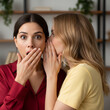 © Eric - Two young women gossiping.