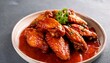 © Karen - chicken wings fried in honey tomato sauce