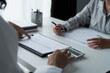 © Wanda - Business people working together in office