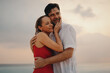 © Jacob Lund - Sunset serenade: Happy mature couple embracing in love and retirement bliss
