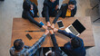 © aFotostock - Top view of MultiEthnics Teamwork high five hands stack shakehand together. Collaboration Team Meeting in Conference Room. Diversity Partner Business Meeting brainstorm hand holding teamwork consult