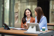 © NINENII - Team of businesswomen analyzing financial charts, planning company growth, and managing corporate strategy