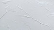 © Firman - Blank abstract background of white crumpled paper. Creased poster texture with wavy surface. Wrinkled white paper background detail.