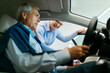 © Westend61 - Salesman advising customer in car dealership