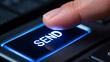 © romio - Finger pressing glowing send button on modern computer keyboard