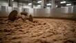 © matkhairul - Close-up view of textured malted grain processing in a large industrial brewery facility