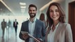 © eka - Smiling business professionals in hallway