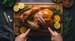 © MD - Hands carving a roasted turkey on a wooden cutting board with lemons and herbs