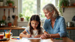 © BloomPix - Grandmother and granddaughter drawing together at a kitchen table, enjoying quality time