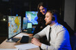 © Serhii - Dispatchers cooperating controlling logistics operations on computer maps