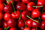 Close up of fresh cherries filling frame, natural light. Sweet red fruit texture, healthy seasonal produce