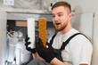 © Serhii - Plumber comparing new and used water filter cartridge