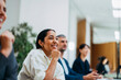 © OchreOchre/Stocksy - Happy Team Meeting In Modern Office