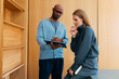 © OchreOchre/Stocksy - Collaborative Discussion With Tablet In Modern Office