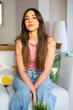 © VICTOR TORRES/Stocksy - Casual portrait of woman in relaxed home setting