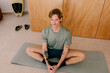 © Adrian Rodd/Stocksy - Modern man practicing yoga in a contemporary apartment