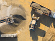 © Lawren Lu/Stocksy - Aerial Loader Filling Truck at Gravel Quarry