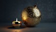 © Agusstudio - Ornate Golden Christmas Ornament and Lit Candle