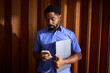© Ivan Jovanovic/Stocksy - Busy man holding technical devices