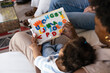 © VICTOR TORRES/Stocksy - Parent and child learning with colorful alphabet board