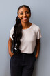 © VICTOR TORRES/Stocksy - Smiling woman with long hair in casual attire