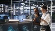© DC Studio - Teamworking engineers in data center integrate AI automation tools together during maintenance session. Server room colleagues configure machine learning models across server infrastructure, camera A