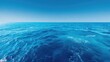 © Sabilu - Deep blue ocean surface stretches out toward the clear horizon under a bright sky