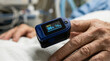 © ViskBx - Closeup of a pulse oximeter on a patients finger in a hospital setting