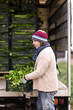© JackF - Middle-aged man loading heavy crates of fresh celery into a truck on plantation