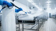© CK Studio - Worker using a high-pressure washer to clean a stainless steel conveyor belt in a sterile food processing factory, ensuring industrial hygiene.