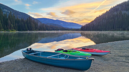 Naklejka na meble Peaceful morning at Lightning Lake with canoes on the shore and mountain reflections, Manning Park, Canada