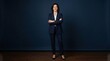 © Fridocha - Confident Businesswoman Standing with Arms Crossed.
