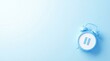 © AspctStyle - Blue alarm clock displaying a pause symbol on a light blue background, flat lay with ample copy space for time management and break concept.