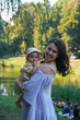 © phpetrunina14 - Mother and Baby Enjoying a Day in the Park portrait at sunset