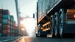 © Laura - A close-up view of a truck on the road, with shipping containers visible in the distance