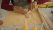 © Krakenimages.com - Man presses and smooths clay with fingers and a wooden paddle on worktable in studio; quiet concentration.