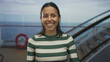 © Krakenimages.com - Woman smiling on cruise ship enjoying seaside scenery outdoors, conveying joy and relaxation with clear ocean backdrop and sunny day on a beautiful journey.