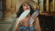 © Krakenimages.com - Woman in bikini with hat and fan holding water bottle in church interior, capturing a surreal and unexpected scene blending summer attire with religious setting.