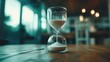© Larisa AI - A striking image of an elegant hourglass placed on a rustic wooden table, symbolizing the passage of time and the beauty of reflection.