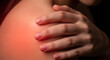 © amin - Focused shot of a painful shoulder, with a hand touching the inflamed area, symbolizing bodily distress and injury