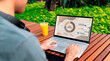 © Rendara Studio - Strategic remote worker reviewing digital expense dashboard outdoors