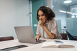 © Friends Stock - Woman Examining Data Carefully. Female Professional Deeply Analyzing Data For Report Preparation