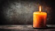 © Liew - A solitary beeswax candle casts a warm, inviting glow against a textured, rustic background, evoking feelings of peace and tranquility.